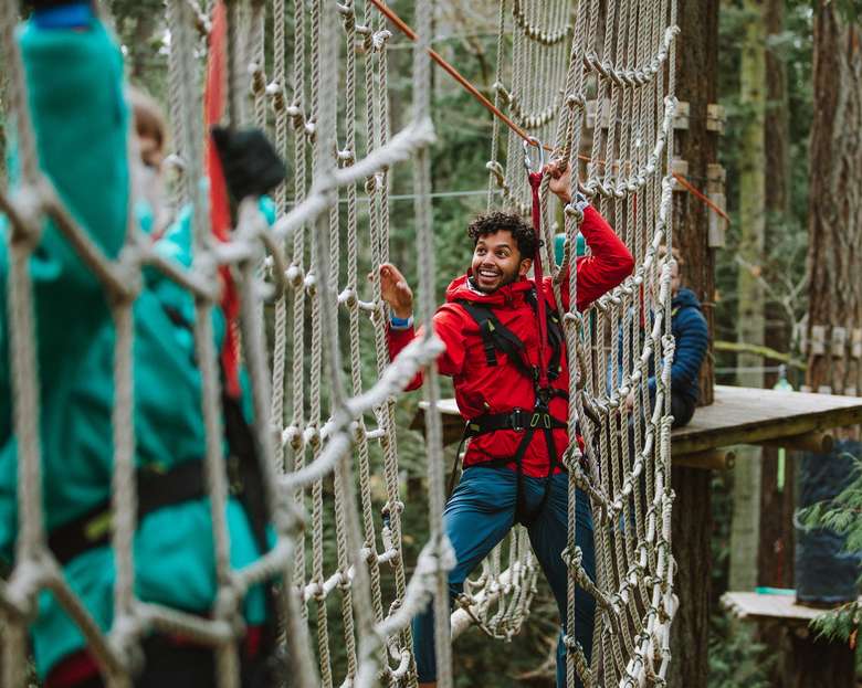 people on treetop net obstacle