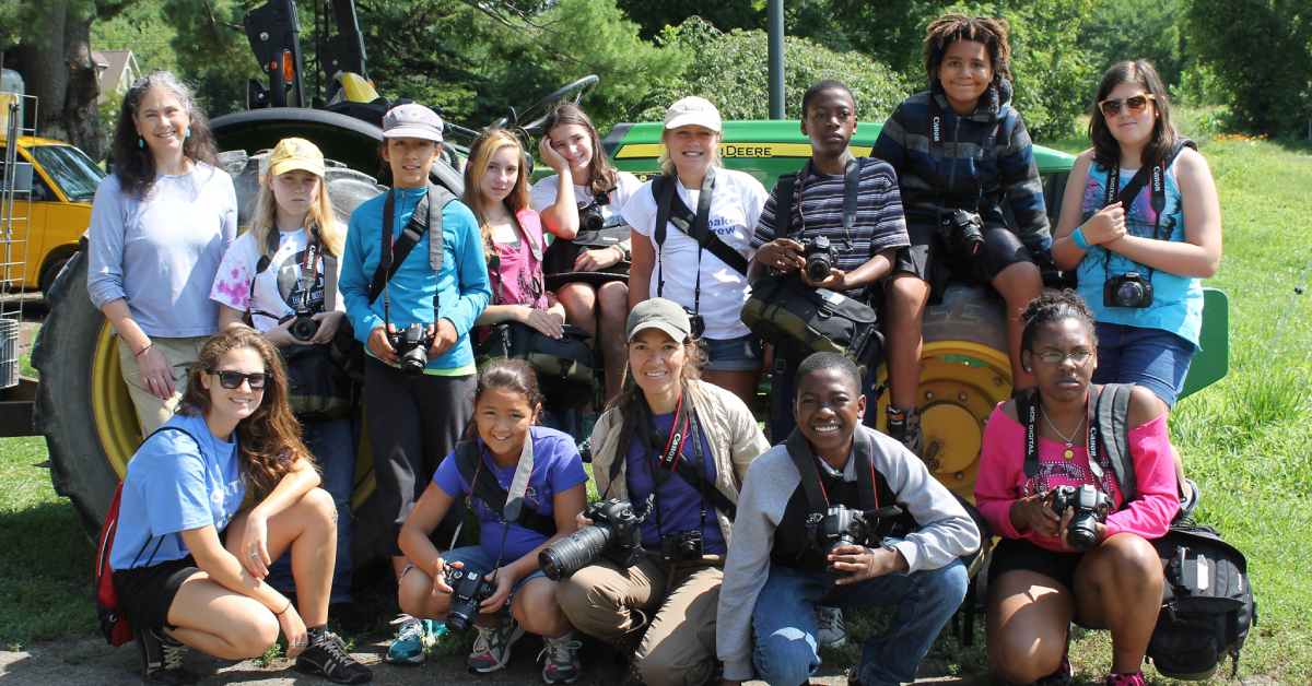 group of kids with cameras smiling