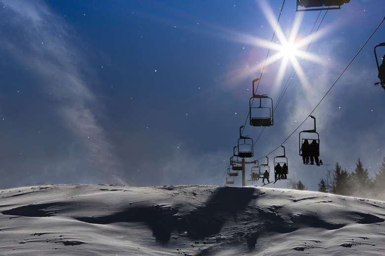 ski lift with night sky