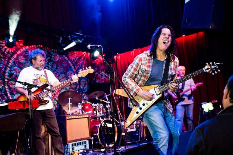 band on stage performs