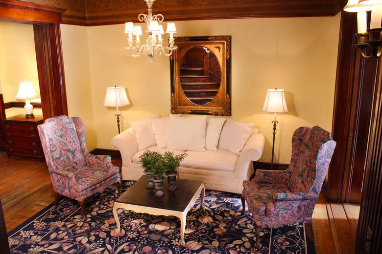 love seat and two chairs surrounding a coffee table