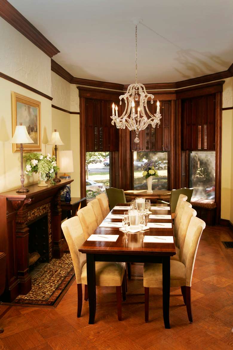 dining room in a historic mansion set up with eight chairs at the table