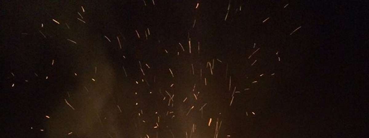people around a large bonfire