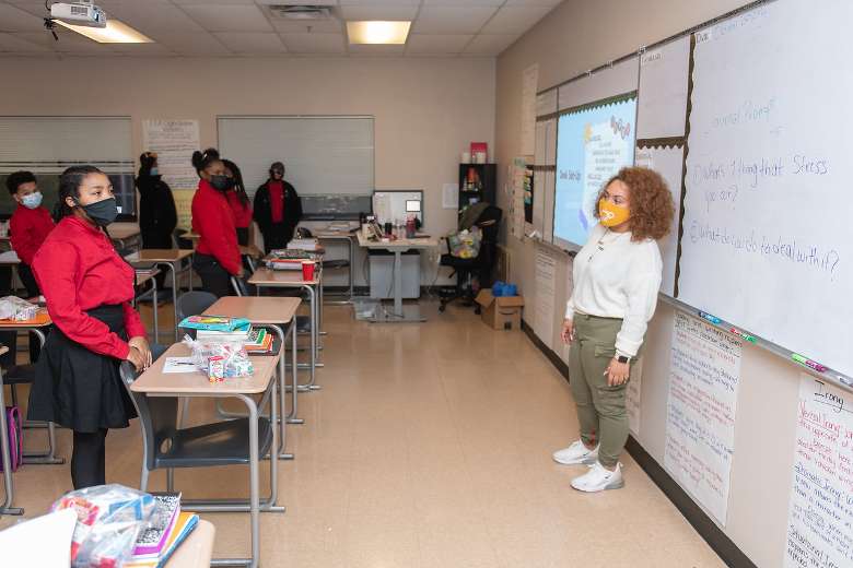 female teacher at the front of a classroom