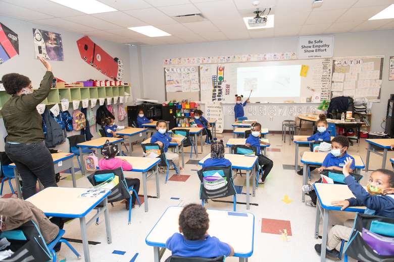 group of kids at desks in a classroom