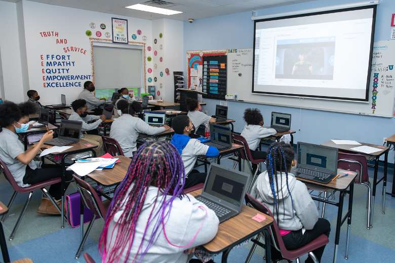 students watching a video in a classroom