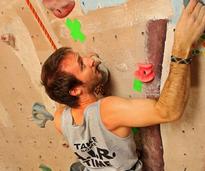 man climbs wall
